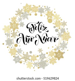 Happy New Year in Spanish text for greeting card. Feliz Ano Nuevo calligraphy with golden and silver ornaments with Christmas wreath decoration of snowflakes.