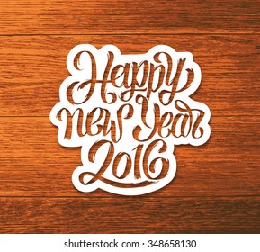 Happy New Year vector greeting card design template with hand lettering text on white paper label and vintage wood background. Festive typography for winter holidays