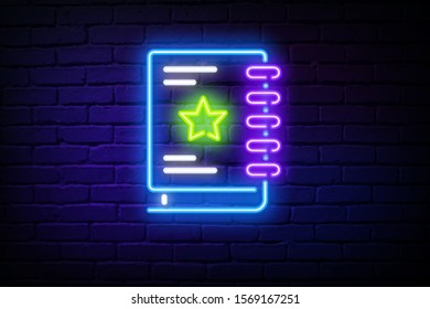 Happy notebook with star neon sign. Stationery, school, education design. Night bright neon sign, colorful billboard, light banner. Vector illustration in neon style.