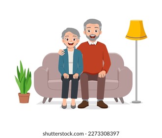 happy old couple sit on sofa and loving together