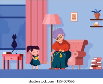 Happy old grandmother and little grandchild girl smiling grandmother knits socks to granddaughter
