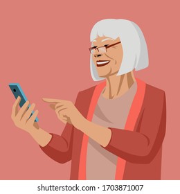 Happy old woman shopping online. Mature senior woman using smartphone.