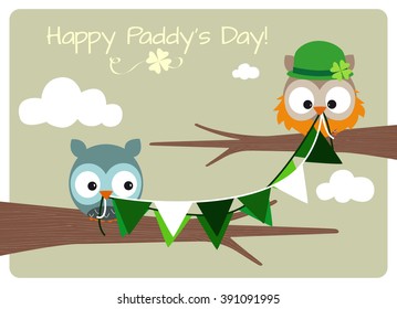 happy paddy's day card, two owls holding flags with irish colors flag in their beaks