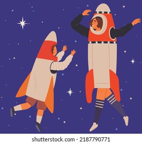 Happy people in cardboard or plastic rocket suits. Men and child in self made costumes dancing in space. Outfit for holiday in cosmic style. Dance of characters wearing spacesuits at costume party