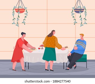 Happy people celebrating important event sitting at table in restaurant or home. Man holding glass with drink talking with ladies. Women offer fruits, canapes at table. Friends colleagues meeting