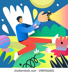 Happy photographer taking pictures of a fairy tale outdoors. Man is happy to practice his favorite hobby. Painting in bright colors. Gradients and RGB colors. A smile on face. Butterfly on the sleeve.
