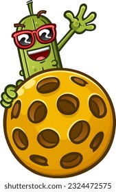 A happy pickle cartoon wearing stylish sunglasses and peeking over from behind a giant pickleball and waving happily with a big smile on his face to show his love of the sport