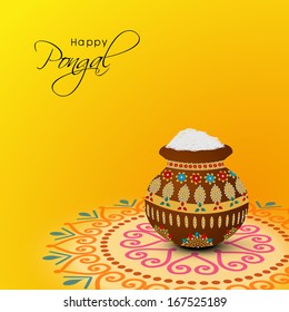 Happy Pongal, harvest festival celebration in South India with pongal rice in a traditional mud pot on beautiful floral design called rangoli.