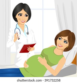 Happy pregnant woman having a doctor visit in hospital