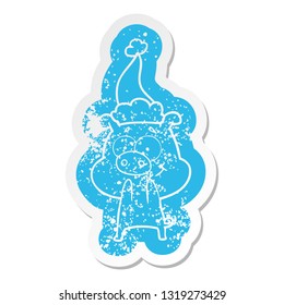 happy quirky cartoon distressed sticker of a pig wearing santa hat
