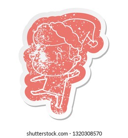 happy quirky cartoon distressed sticker of a man wearing santa hat