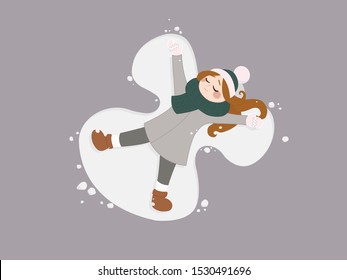 Happy red-haired girl in a green-pink hat and scarf, gray coat, white gloves and socks makes a snow angel with closed eyes in the Christmas holidays on a neutral light background.