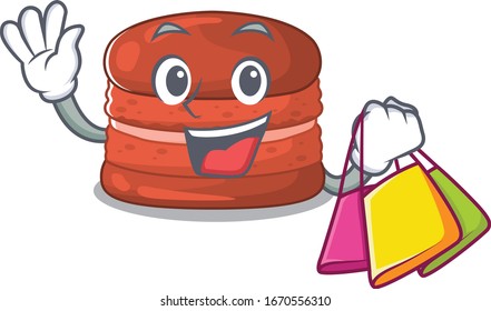 Happy rich cherry macaron mascot design waving and holding Shopping bag