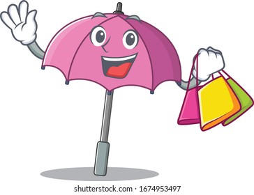 Happy rich pink umbrella mascot design waving and holding Shopping bag