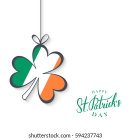 Happy Saint Patrick's Day greeting card with handwritten wishes and clover in colors of the irish national flag. Vector illustration.