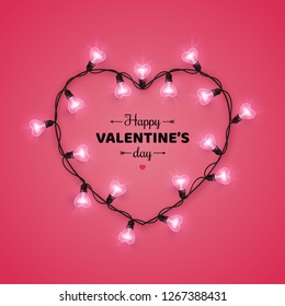 Happy Saint Valentine's day card with heart shaped light bulbs on pink background. Holiday illuminated frame made of garland wire