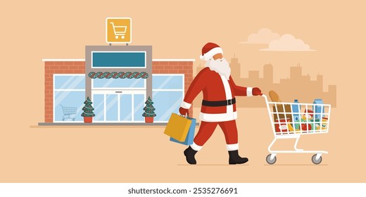 Happy Santa Claus doing grocery shopping, he is pushing a full shopping cart and holding bags, supermarket in the background