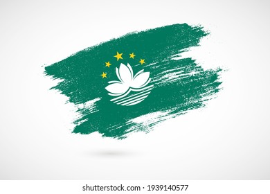Happy SAR Establishment day of Macau with vintage style brush flag background