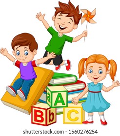 Happy school children with alphabet blocks