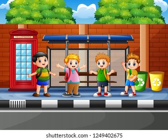 Happy school children at the bus stop