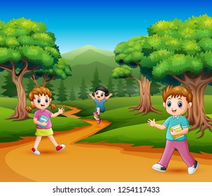 Happy school children in the forest