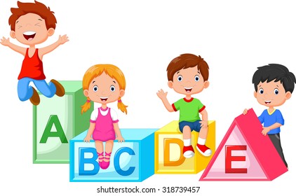 Happy school children playing with alphabet blocks