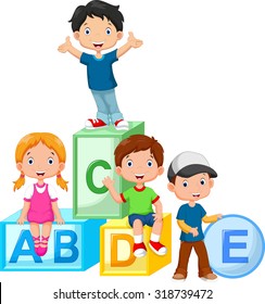 Happy school children playing with alphabet blocks