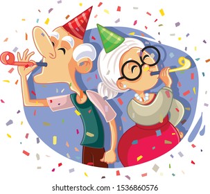 Happy Senior Couple with Party Whistles and Confetti. Grandfather and grandmother celebrating wedding anniversary 
