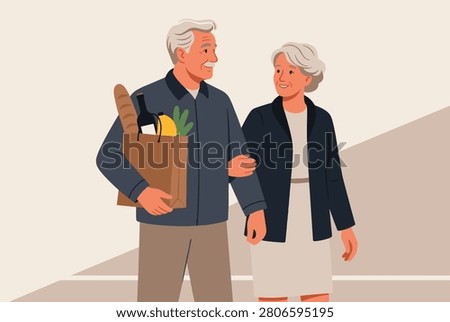 Happy senior couple walking together arm in arm while the man carries a brown paper bag filled with fresh groceries and bread.