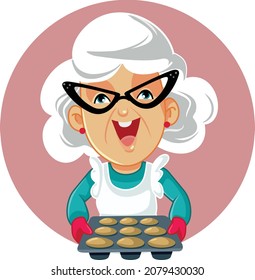 Happy Senior Woman Holding a Tray of Muffins Vector Cartoon. Grandma baking sweet desert at home with traditional recipe
