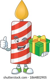Happy smiley candle cartoon mascot design with a gift box. Vector illustration