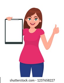 Happy smiling beautiful young woman 
holding / showing a blank clipboard and gesture hand thumbs up sign, while standing against white background. Concept illustration in vector cartoon flat style.