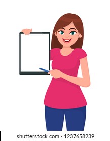 Happy smiling beautiful young woman 
holding / showing a blank clipboard and pointing with pen while standing against  white background isolated. Concept illustration in vector cartoon flat style.