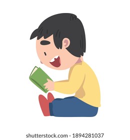 Happy Smiling Boy Sitting On Floor and Reading Book, Adorable Kid Enjoying of Literature, Elementary School Student Character Cartoon Style Vector Illustration