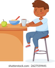 Happy smiling boy sitting on stool at table, having breakfast, eating porridge with spoon and drinking hot tea or coffee from mug, healthy food for kids, healthy nutrition for children concept