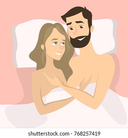 Happy smiling couple in bed lying naked.