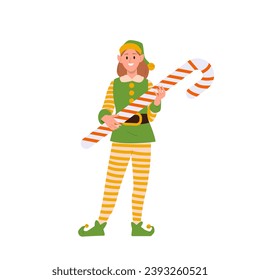 Happy smiling girl elf character Santa Claus helper holding candy cane sweet tasty Christmas dessert