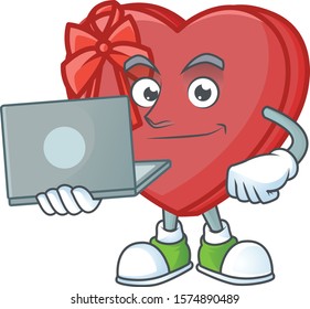 Happy smiling love gift box cartoon character working with laptop