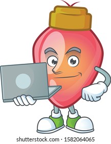 Happy smiling red christmas bulb cartoon character working with laptop
