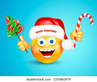 Happy smiling round face wearing a red santa claus hat holding christmas candies fir-tree and cane on bright blue background. Cartoon character. Icon