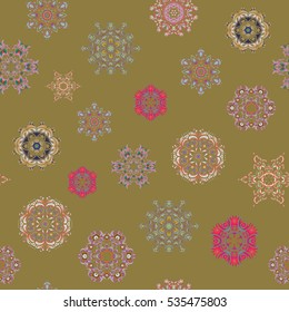 Happy smiling snowflakes seamless pattern. Vector winter design on a green background. Snowflakes decorated with circles and dots. Christmas and New Year theme.