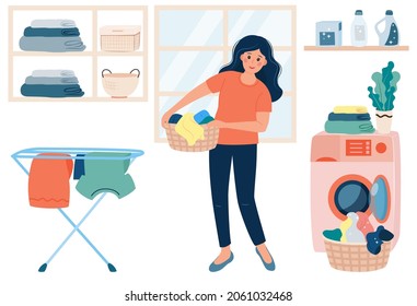 Happy smiling Woman doing laundry at home. Young woman holding basket with clean clothes stand near washing machine.  Housewife doing laundry. Laundry service and housework concept.