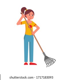 Happy smiling woman with hand work tool rake isolated on white background. Girl gardener raking ground. Young lady working in garden. Gardening and farming, horticulture and agriculture