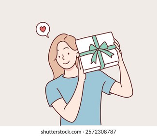 Happy smiling woman holding gift box. Hand drawn style vector design illustrations.	