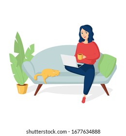 Happy smiling young girl in home clothes with a mug of tea sits on a sofa with a laptop on her lap. Nearby lies a cat. Remote work from home. Freelance. Stay at home