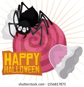 Happy spider over giant candy in translucent cover, ready to eat it and celebrate Halloween.