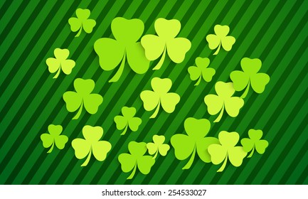 Happy St. Patrick's Day background with shiny shamrock leaves. 