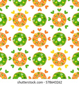Happy St. Patrick's Day. Candy seamless pattern with donuts, clover and hearts. Sweet background. 