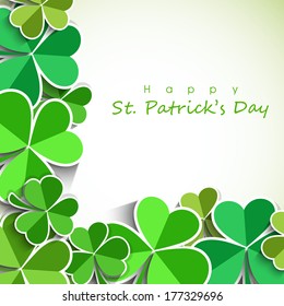 Happy St. Patrick's Day celebration poster, banner or flyer with clover leaves on abstract background.
