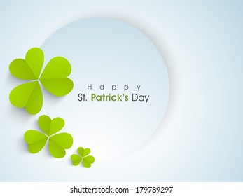 Happy St. Patrick's Day celebration concept with beautiful four leaves lucky clover and stylish text on blue, can be use as sticker, tag or label.